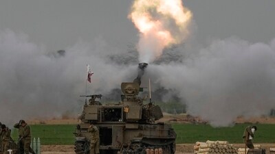 Israel-Hamas War: An Israeli mobile artillery unit fires a shell from southern Israel towards the Gaza Strip, in a position near the Israel-Gaza border. (AP) Israel-Hamas War: An Israeli mobile artillery unit fires a shell from southern Israel towards the Gaza Strip, in a position near the Israel-Gaza border. (AP)