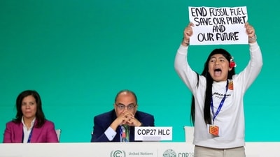 Licypriya Kangujam, an Indigenous climate activist from India, holds a banner during the United Nations Climate Change Conference (COP28) in Dubai, United Arab Emirates, on December 11. (REUTERS)