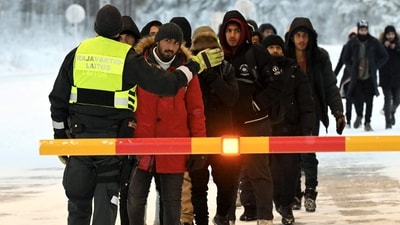 A Finnish Border Guard speaks to migrants at the international border crossing at Salla, northern Finland. (AFP File) A Finnish Border Guard speaks to migrants at the international border crossing at Salla, northern Finland. (AFP File)