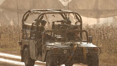 Israel-Hamas War: An Israeli military vehicle advances near the border with the Gaza Strip in southern Israel. (AFP)