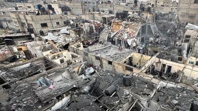 People search through the rubble of damaged buildings following an Israeli air strike on Palestinian houses, amid the ongoing conflict between Israel and the Palestinian Islamist group Hamas, in Rafah in the southern Gaza Strip (REUTERS)