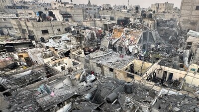People search through the rubble of damaged buildings following an Israeli air strike on Palestinian houses, amid the ongoing conflict between Israel and the Palestinian Islamist group Hamas, in Rafah in the southern Gaza Strip (REUTERS)