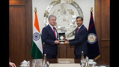 National Investigation Agency (NIA) director general Dinkar Gupta presents a memento to Federal Bureau of Investigation (FBI) director Christopher A Wray during a meeting, in New Delhi on Tuesday. (PTI) National Investigation Agency (NIA) director general Dinkar Gupta presents a memento to Federal Bureau of Investigation (FBI) director Christopher A Wray during a meeting, in New Delhi on Tuesday. (PTI)