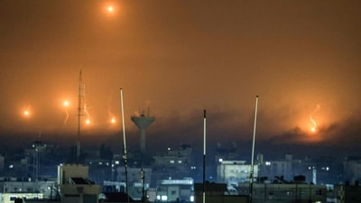 A picture taken from Rafah shows flares amids smoke over Khan Yunis in the southern Gaza Strip during Israeli strikes. (AFP) A picture taken from Rafah shows flares amids smoke over Khan Yunis in the southern Gaza Strip during Israeli strikes. (AFP)