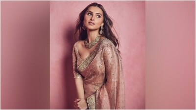 Lastly, Tara chose shimmering pink eye shadow, smudged eyeliner, kohl-lined eyes, mascara-adorned lashes, feathered brows, rouge on the cheeks, beaming highlighter, mauve lip shade, and a dainty bindi for the glam picks. Centre-parted open wavy locks rounded off her hairstyle with the ethnic ensemble. (Instagram) Lastly, Tara chose shimmering pink eye shadow, smudged eyeliner, kohl-lined eyes, mascara-adorned lashes, feathered brows, rouge on the cheeks, beaming highlighter, mauve lip shade, and a dainty bindi for the glam picks. Centre-parted open wavy locks rounded off her hairstyle with the ethnic ensemble. (Instagram)