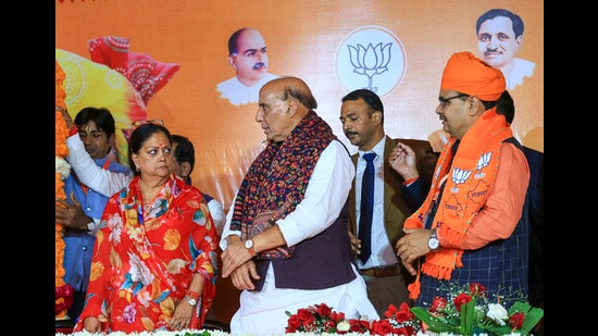 Defence minister Rajnath Singh, former Rajasthan CM Vasundhara Raje and newly-elected Rajasthan CM Bhajan Lal Sharma in Jaipur. (PTI)