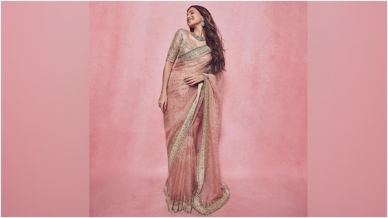 Celebrity stylist Meagan Concessio took to Instagram to share pictures of Tara Sutaria. "Pretty in pink," Meagan captioned the post. The photos show the actor posing in a gorgeous pink saree and embroidered blouse. The ensemble is from the shelves of the clothing label A&B by Rhea Kapoor. Read our download on it below. (Instagram)