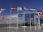 Flags flutter in the wind outside Nato headquarters in Brussels, Belgium. (AP) Flags flutter in the wind outside Nato headquarters in Brussels, Belgium. (AP)