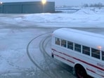 This image provided by Delta flight passenger shows the buses used to transport passengers to military barracks in Goose Bay, Canada, on Monday, Dec. 11, 2023 This image provided by Delta flight passenger shows the buses used to transport passengers to military barracks in Goose Bay, Canada, on Monday, Dec. 11, 2023