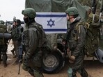 Israeli soldiers prepare to enter the Gaza Strip, amid the ongoing conflict between Israel and the Palestinian Islamist group Hamas, at Israel's border with Gaza in southern Israel. (Reuters)