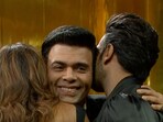 Karan Johar hugging Deepika Padukone and Ranveer Singh on Koffee with Karan Season 8