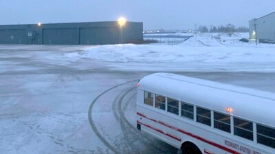 This image provided by Delta flight passenger shows the buses used to transport passengers to military barracks in Goose Bay, Canada, on Monday, Dec. 11, 2023 (AP)