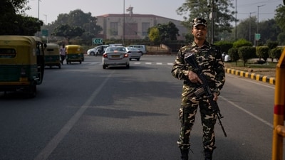 An Indian paramilitary soldier stands guard at a checkpoint setup outside the Indian parliament in New Delh on the anniversary of a deadly 2001 terrorist attack on the complex. (AP) An Indian paramilitary soldier stands guard at a checkpoint setup outside the Indian parliament in New Delh on the anniversary of a deadly 2001 terrorist attack on the complex. (AP)