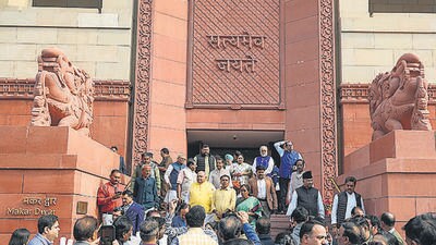 Lawmakers leave Parliament House following the security breach on Monday. (PTI) Lawmakers leave Parliament House following the security breach on Monday. (PTI)