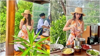 Manushi wore a sleeveless white dress for the class. It features a halter plunging V-neckline, cinched waist, tropical-inspired patterns in different shades, and a flowy skirt.&nbsp; (Instagram)