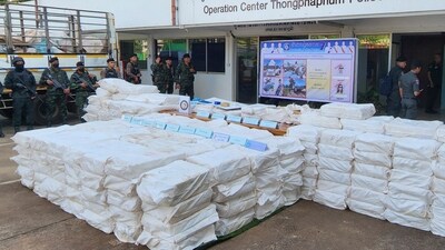 Thai soldiers stand beside seized 50 million methamphetamine pills hidden in sacks during a news conference at Thongphaphum Police station in Kanchanaburi province, Thailand, (AP) Thai soldiers stand beside seized 50 million methamphetamine pills hidden in sacks during a news conference at Thongphaphum Police station in Kanchanaburi province, Thailand, (AP)