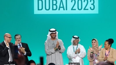 COP28 president Sultan Ahmed Al Jaber (C) applauds among other officials before a plenary session during the United Nations climate summit in Dubai on December 13, 2023. (AFP) COP28 president Sultan Ahmed Al Jaber (C) applauds among other officials before a plenary session during the United Nations climate summit in Dubai on December 13, 2023. (AFP)