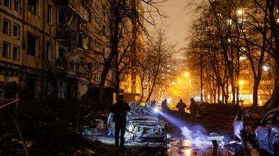 Emergency staff work at a site of an apartment building damaged during a Russian missile strike (REUTERS)