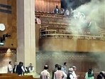 Ruckus inside the Lok Sabha after two men jumped from the visitors' gallery and started spraying yellow gas. Ruckus inside the Lok Sabha after two men jumped from the visitors' gallery and started spraying yellow gas.