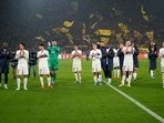 PSG's team players applaud after the Champions League Group F soccer match between Borussia Dortmund and Paris Saint-Germain at the Signal Iduna Park in Dortmund.