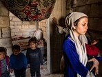 Displaced Syrians living in war-damaged buildings, are pictured in Syria's rebel-held northern city of Raqa on March 1, amid fears that the already fragile dwellings will not withstand an earthquake.