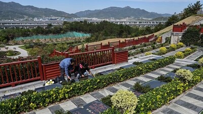 At a quiet cemetery in eastern China, bereaved father Seakoo Wu pulls out his phone, places it on a black granite gravestone and plays a recording of his son. They are words that the late student never spoke, but brought into being with artificial intelligence. (AFP) At a quiet cemetery in eastern China, bereaved father Seakoo Wu pulls out his phone, places it on a black granite gravestone and plays a recording of his son. They are words that the late student never spoke, but brought into being with artificial intelligence. (AFP)