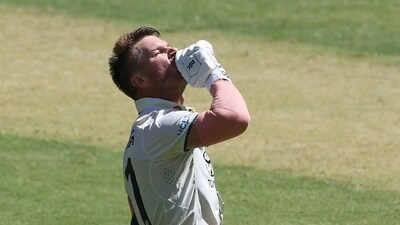 David Warner celebrates his century during the first day of the first Test cricket match between Australia and Pakistan at Optus Stadium in Perth (AFP) David Warner celebrates his century during the first day of the first Test cricket match between Australia and Pakistan at Optus Stadium in Perth (AFP)