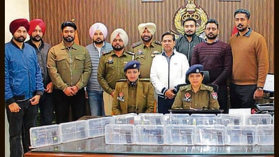 Khanna senior superintendent of police Amneet Kondal and other police officials displays the seized weapons during a press conference in Ludhiana on Thursday. (HT Photo) Khanna senior superintendent of police Amneet Kondal and other police officials displays the seized weapons during a press conference in Ludhiana on Thursday. (HT Photo)