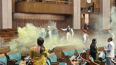 The scenes inside the Lok Sabha after an unidentified man jumped from the visitors’ gallery, evaded MPs, and released coloured smoke on Wednesday. (HT_PRINT) The scenes inside the Lok Sabha after an unidentified man jumped from the visitors’ gallery, evaded MPs, and released coloured smoke on Wednesday. (HT_PRINT)
