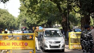 Police personnel inspect a vehicle as security tightens outside Parliament following the recent security breach that took place in Lok Sabha during the ongoing Winter Session in New Delhi on Thursday. (ANI) Police personnel inspect a vehicle as security tightens outside Parliament following the recent security breach that took place in Lok Sabha during the ongoing Winter Session in New Delhi on Thursday. (ANI)