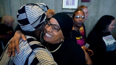 Boston City Councilor Tania Fernandes Anderson, center, celebrates with supporters, Wednesday, Oct. 25, 2023, at City Hall in Boston, after the council voted in favor of holding a hearing on renaming Faneuil Hall. Fernandes Anderson has filed a resolution decrying the building's namesake, Peter Faneuil, as a "white supremacist, a slave trader, and a slave owner who contributed nothing recognizable to the ideal of democracy." (AP Photo/Steven Senne) (AP) Boston City Councilor Tania Fernandes Anderson, center, celebrates with supporters, Wednesday, Oct. 25, 2023, at City Hall in Boston, after the council voted in favor of holding a hearing on renaming Faneuil Hall. Fernandes Anderson has filed a resolution decrying the building's namesake, Peter Faneuil, as a "white supremacist, a slave trader, and a slave owner who contributed nothing recognizable to the ideal of democracy." (AP Photo/Steven Senne) (AP)