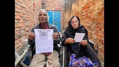 Sajida and Idris with a photo of their missing adopted son. (Sourced) Sajida and Idris with a photo of their missing adopted son. (Sourced)