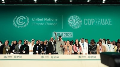 UN Climate Chief Simon Stiell, COP28 President Sultan al-Jaber and UAE chief negotiator Hana Al-Hashimi with others on Wednesday. (AP) UN Climate Chief Simon Stiell, COP28 President Sultan al-Jaber and UAE chief negotiator Hana Al-Hashimi with others on Wednesday. (AP)