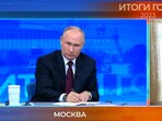 Russian President Vladimir Putin (left) during his annual news conference.
