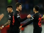 Bayer Leverkusen's Adam Hlozek celebrates scoring their fifth goal with Amine Adli