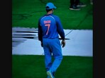 The image shows MS Dhoni wearing his iconic jersey number 7. The image shows MS Dhoni wearing his iconic jersey number 7.