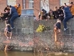 A group of people rescuing a pet dog. A group of people rescuing a pet dog.