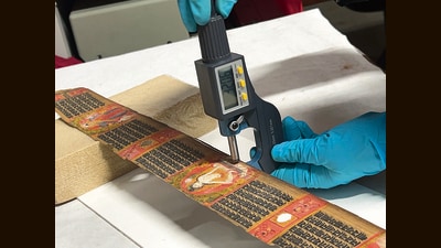 A 12th- century palm leaf manuscript is examined as part of the project, at the Asiatic Society, Mumbai. (Mapping Color in History) A 12th- century palm leaf manuscript is examined as part of the project, at the Asiatic Society, Mumbai. (Mapping Color in History)