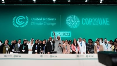 United Nations Climate Chief Simon Stiell, from left, COP28 President Sultan al-Jaber and Hana Al-Hashimi, chief COP28 negotiator for the United Arab Emirates, pose for photos at the end of the COP28 UN Climate Summit. (AP) United Nations Climate Chief Simon Stiell, from left, COP28 President Sultan al-Jaber and Hana Al-Hashimi, chief COP28 negotiator for the United Arab Emirates, pose for photos at the end of the COP28 UN Climate Summit. (AP)