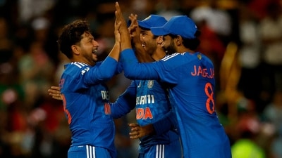 India's Kuldeep Yadav (L) celebrates with teammates (AFP)