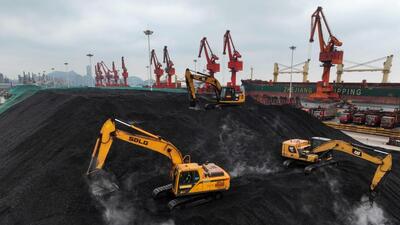 Diggers pile coal after it was unloaded from a ship at the coal terminal of Lianyungang Port, in China’s eastern Jiangsu province on December 15, 2023. (AFP) Diggers pile coal after it was unloaded from a ship at the coal terminal of Lianyungang Port, in China’s eastern Jiangsu province on December 15, 2023. (AFP)