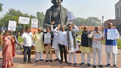 Karnataka Bharatiya Janata Party (BJP) MPs hold placards as they stage a protest in front of the Mahatma Gandhi statue against the Karnataka Government after a woman was allegedly assaulted in Belagavi, during the Winter Session of the Parliament in New Delhi on Friday. (ANI) Karnataka Bharatiya Janata Party (BJP) MPs hold placards as they stage a protest in front of the Mahatma Gandhi statue against the Karnataka Government after a woman was allegedly assaulted in Belagavi, during the Winter Session of the Parliament in New Delhi on Friday. (ANI)