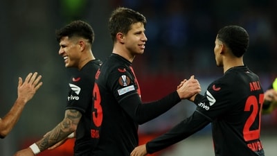Bayer Leverkusen's Adam Hlozek celebrates scoring their fifth goal with Amine Adli (REUTERS)