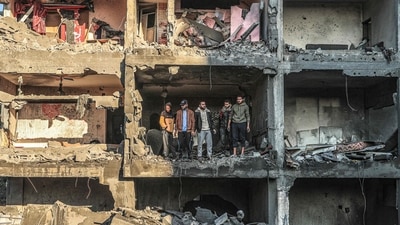 Palestinians check a half destroyed building following Israeli bombardment on Rafah, in the southern Gaza Strip (AFP) Palestinians check a half destroyed building following Israeli bombardment on Rafah, in the southern Gaza Strip (AFP)