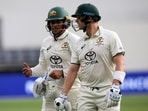 Australia's Usman Khawaja (L) and teammate Steve Smith walk off at close of play on day three of the first Test cricket match between Australia and Pakistan Australia's Usman Khawaja (L) and teammate Steve Smith walk off at close of play on day three of the first Test cricket match between Australia and Pakistan