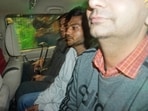 Sagar Sharma, center, an accused in the security breach in parliament, is escorted to be taken into police custody in New Delhi,