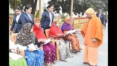 Chief minister Yogi Adityanath during Janta Darbar at Goraknath temple in Gorakhpur on Saturday. (HT PHOTO)