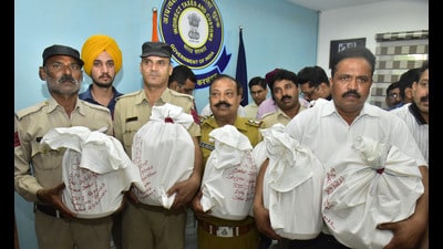 Customs officials showing seized 102kg heroin at the Attari border. (HT File)