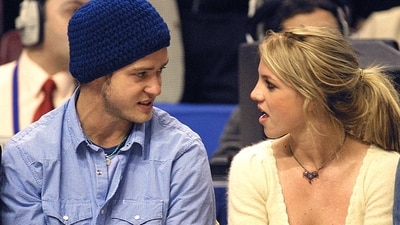 Britney Spears with then-boyfriend Justin Timberlake during an NBA match in 2002. Britney has said in her new memoir that she had an abortion during her relationship with Justin over two decades ago. (File Photo/ AFP)