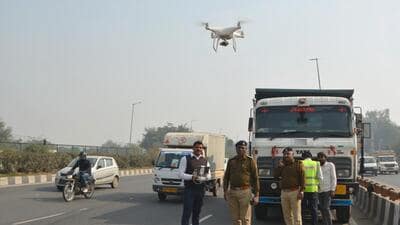Gurugram traffic police with their drone on National Highway-48 near Rajiv Chowk in Gurugram on Friday. (Parveen Kumar/HT Photo) Gurugram traffic police with their drone on National Highway-48 near Rajiv Chowk in Gurugram on Friday. (Parveen Kumar/HT Photo)
